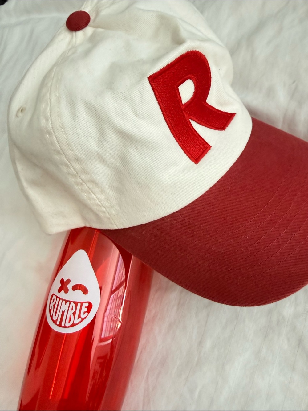 Rumble White and Red Baseball Cap and water bottle